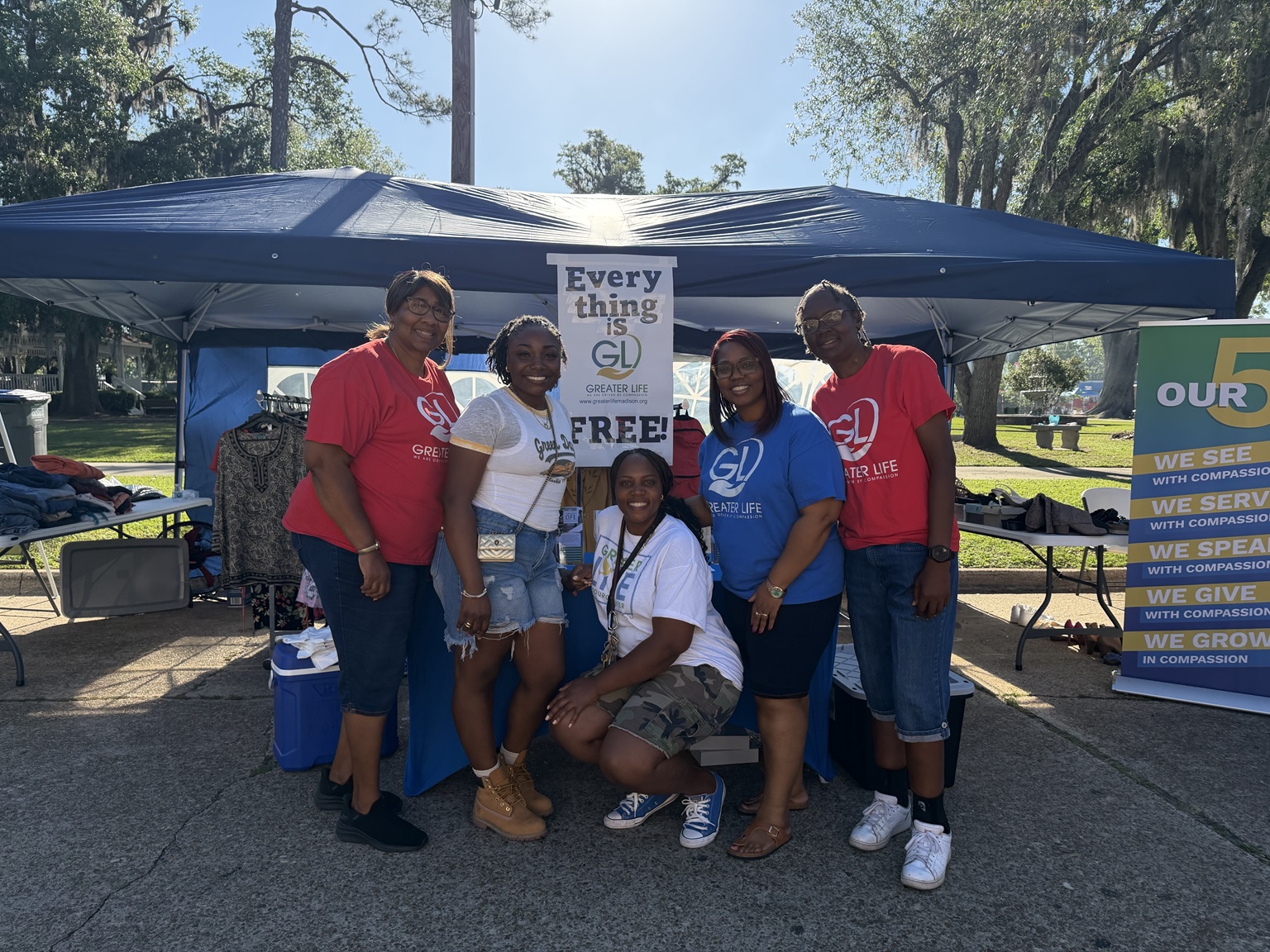 Greater Life volunteers serving together at a free community giveaway