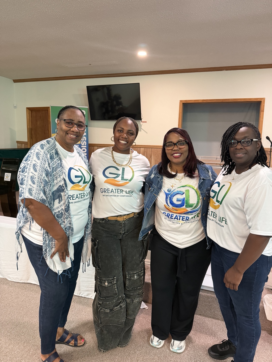 Greater Life members together in their church shirts